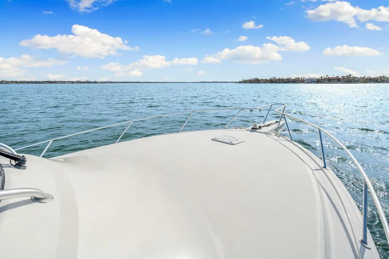 Bad Habit Yacht Photos Pics Bow view of 2012 Viking 42 Open yacht cruising on a sunny day.