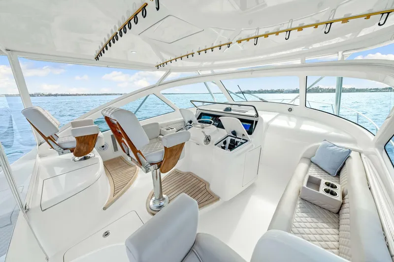 Bad Habit Yacht Photos Pics Luxurious interior of 2012 Viking 42 Open yacht with plush seating and helm station.