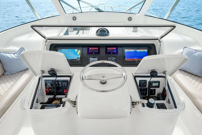 Bad Habit Yacht Photos Pics Helm of 2012 Viking 42 Open yacht with navigation screens and controls.