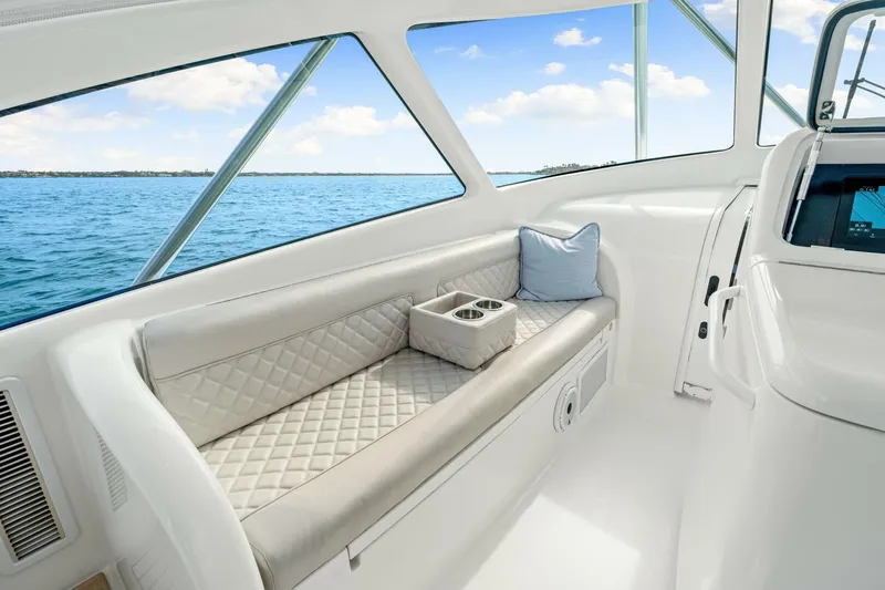 Bad Habit Yacht Photos Pics Luxurious interior of 2012 Viking 42 Open yacht with quilted seating and ocean view.