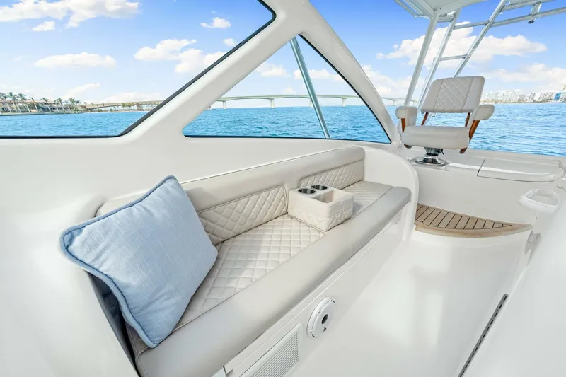 Bad Habit Yacht Photos Pics Luxurious interior of 2012 Viking 42 Open yacht with plush seating and ocean view.