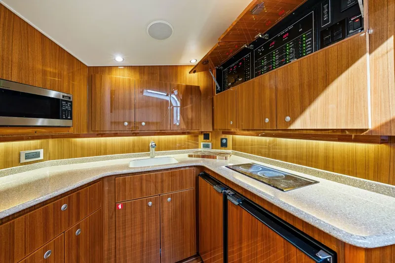 Bad Habit Yacht Photos Pics Luxurious 2012 Viking 42 Open yacht kitchen with wood cabinetry and modern appliances.