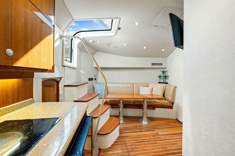 Bad Habit Yacht Photos Pics Interior of 2012 Viking 42 Open yacht with modern seating and wooden flooring.