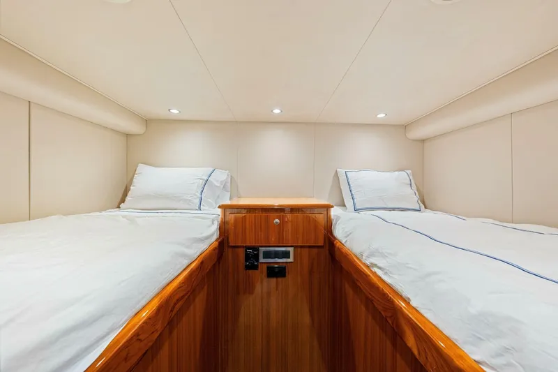 Bad Habit Yacht Photos Pics Luxurious cabin interior of 2012 Viking 42 Open yacht with twin beds and wood finish.