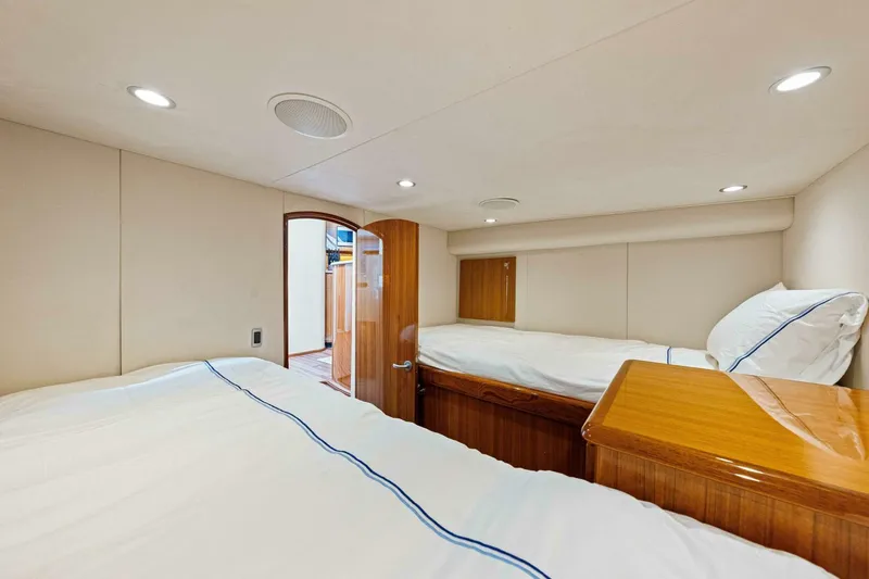 Bad Habit Yacht Photos Pics 2012 Viking 42 Open yacht cabin with twin beds and wooden accents.