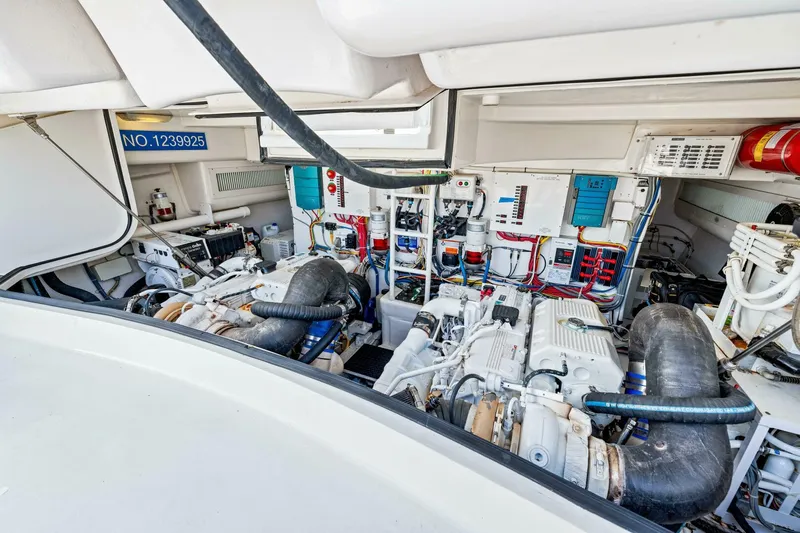 Bad Habit Yacht Photos Pics Engine room of 2012 Viking 42 Open yacht, showcasing complex machinery and wiring.