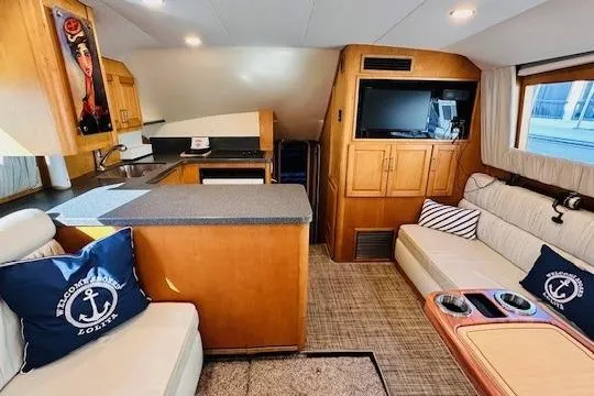 Lolita Yacht Photos Pics Interior of 2001 Luhrs 40 Convertible yacht with cozy seating and modern kitchen.