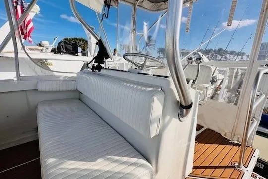 Lolita Yacht Photos Pics 2001 Luhrs 40 Convertible boat interior with white seating and steering wheel.
