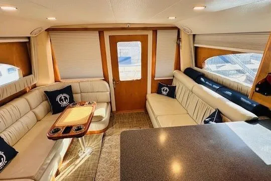 Lolita Yacht Photos Pics Luxurious interior of 2001 Luhrs 40 Convertible yacht with plush seating and elegant decor.