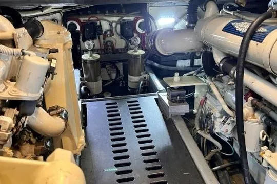 Lolita Yacht Photos Pics Engine room of 2001 Luhrs 40 Convertible boat, showcasing mechanical components and systems.