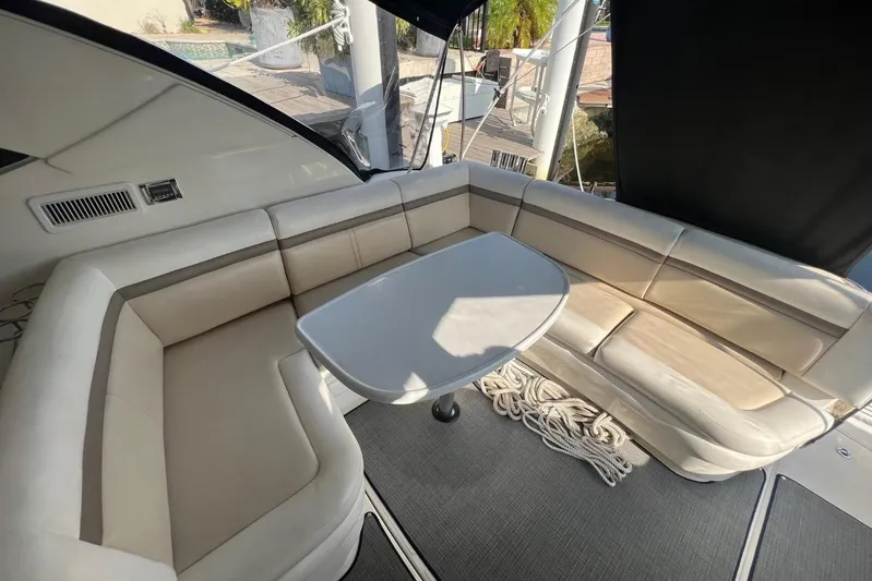  Yacht Photos Pics Luxurious seating area on a 2014 Sea Ray 410 Sundancer yacht with a sleek table.