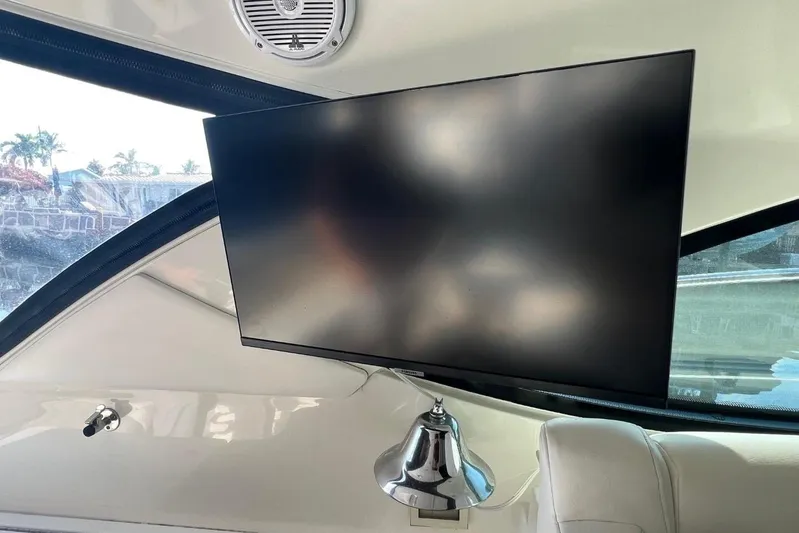  Yacht Photos Pics Flat-screen TV inside 2014 Sea Ray 410 Sundancer yacht, with speaker and window view.