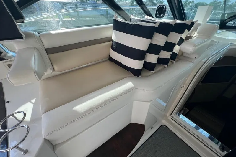  Yacht Photos Pics Luxurious seating area on a 2014 Sea Ray 410 Sundancer with striped cushions.