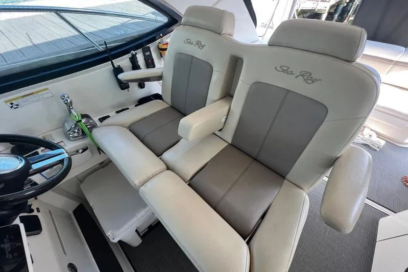  Yacht Photos Pics Captain's seats on 2014 Sea Ray 410 Sundancer yacht, featuring luxurious design and controls.