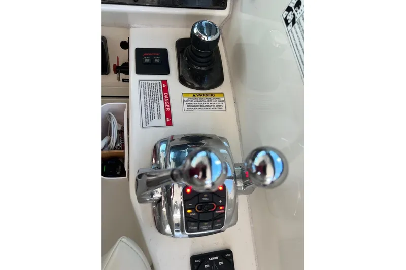  Yacht Photos Pics Control panel of a 2014 Sea Ray 410 Sundancer boat with throttle levers and joystick.