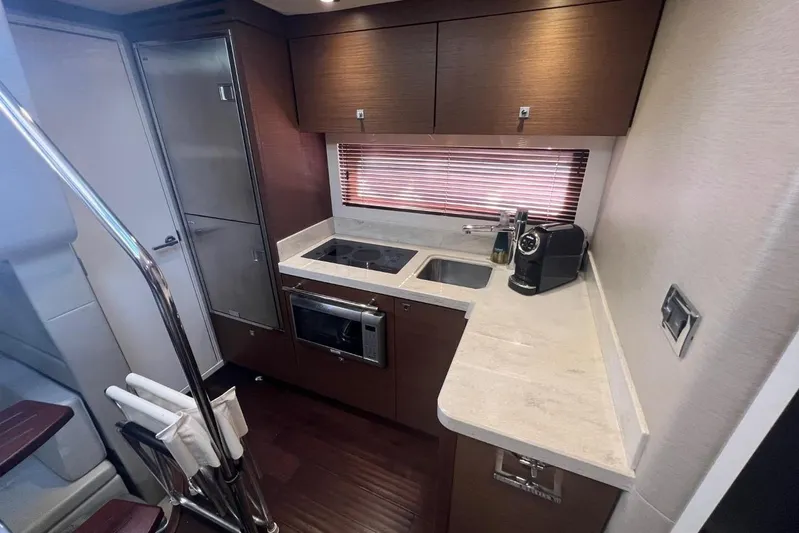  Yacht Photos Pics Luxurious 2014 Sea Ray 410 Sundancer yacht kitchen with modern appliances and sleek design.