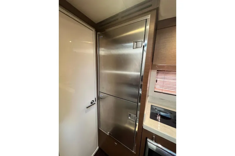  Yacht Photos Pics Interior of 2014 Sea Ray 410 Sundancer yacht with stainless steel fridge.