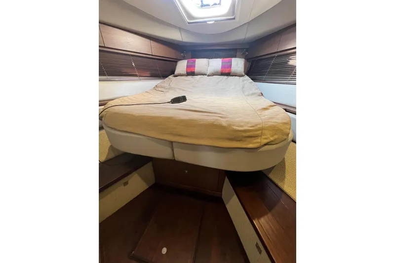 Yacht Photos Pics Luxurious cabin interior of 2014 Sea Ray 410 Sundancer yacht with cozy bed.