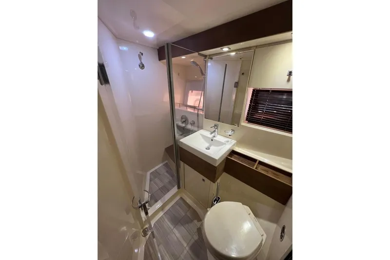  Yacht Photos Pics Luxurious bathroom in 2014 Sea Ray 410 Sundancer yacht with modern fixtures.