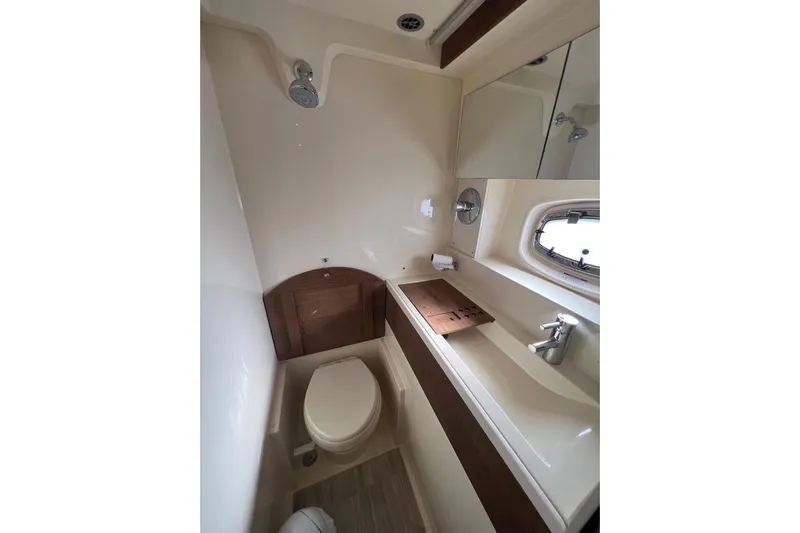  Yacht Photos Pics 2014 Sea Ray 410 Sundancer bathroom with shower, sink, and toilet.