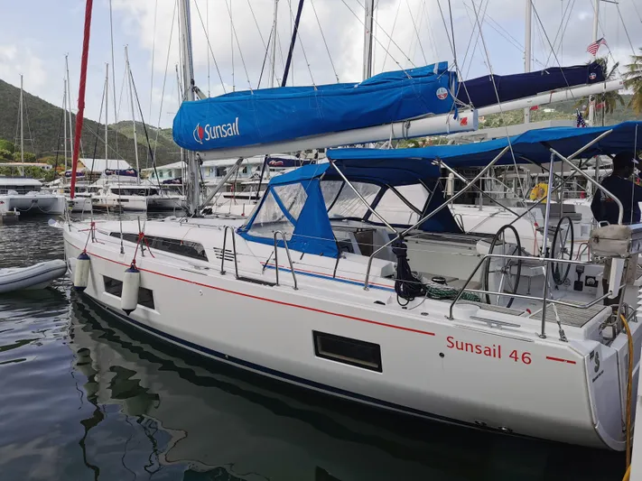 Siman H Yacht Photos Pics 2020 Beneteau Oceanis 46.1 sailboat docked in marina, featuring Sunsail branding.