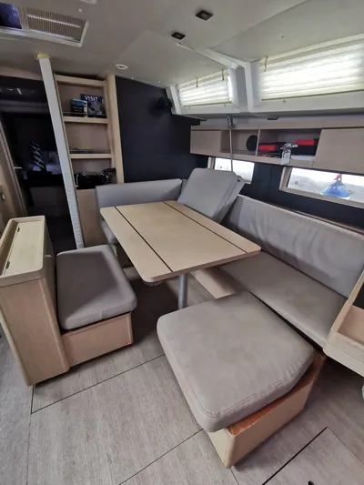 Siman H Yacht Photos Pics Interior of 2020 Beneteau Oceanis 46.1 yacht with modern seating and dining area.
