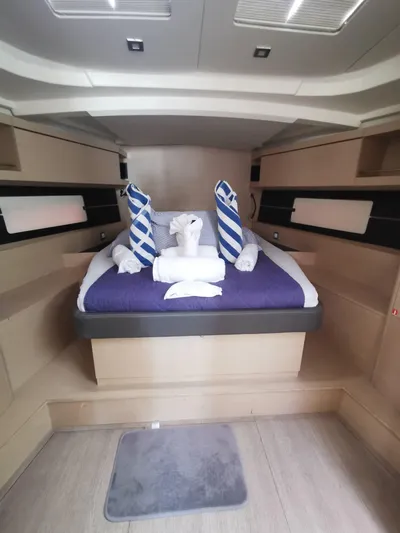 Siman H Yacht Photos Pics Luxurious cabin interior of 2020 Beneteau Oceanis 46.1 yacht with neatly arranged bedding.