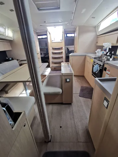 Siman H Yacht Photos Pics Interior of 2020 Beneteau Oceanis 46.1 yacht, featuring modern kitchen and seating area.