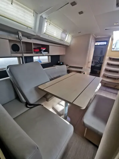 Siman H Yacht Photos Pics Interior of 2020 Beneteau Oceanis 46.1 yacht with modern seating and dining area.