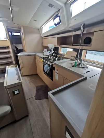 Siman H Yacht Photos Pics Interior of 2020 Beneteau Oceanis 46.1 yacht, featuring modern kitchen and sleek cabinetry.