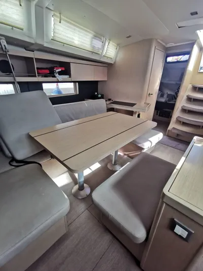 Siman H Yacht Photos Pics Interior of 2020 Beneteau Oceanis 46.1 yacht with modern seating and table.