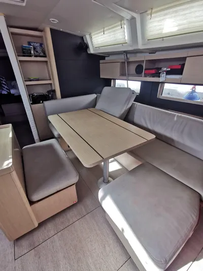 Siman H Yacht Photos Pics Interior of 2020 Beneteau Oceanis 46.1 yacht with modern dining area and seating.