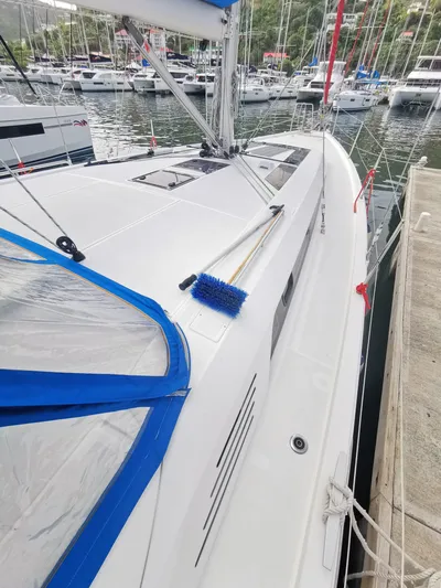 Siman H Yacht Photos Pics 2020 Beneteau Oceanis 46.1 sailboat docked in marina, featuring sleek deck design.