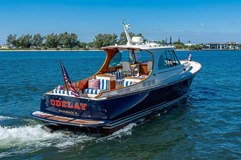 Odelay Yacht Photos Pics 2016 Hinckley Picnic Boat MKIII cruising on blue waters near Palm Beach, Florida.