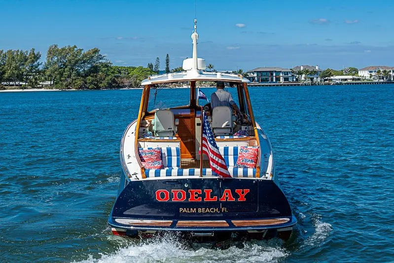 Odelay Yacht Photos Pics 2016 Hinckley Picnic Boat MKIII cruising on blue waters near Palm Beach, Florida.