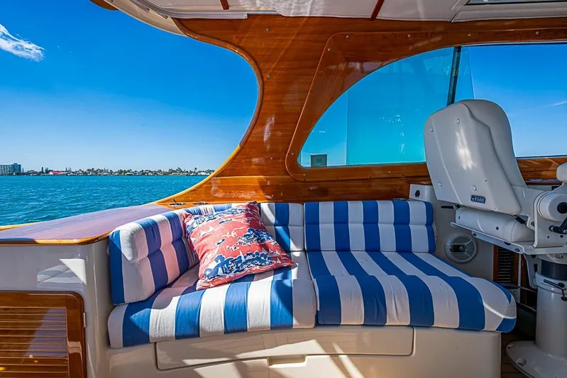 Odelay Yacht Photos Pics 2016 Hinckley Picnic Boat MKIII interior with striped seating and scenic ocean view.