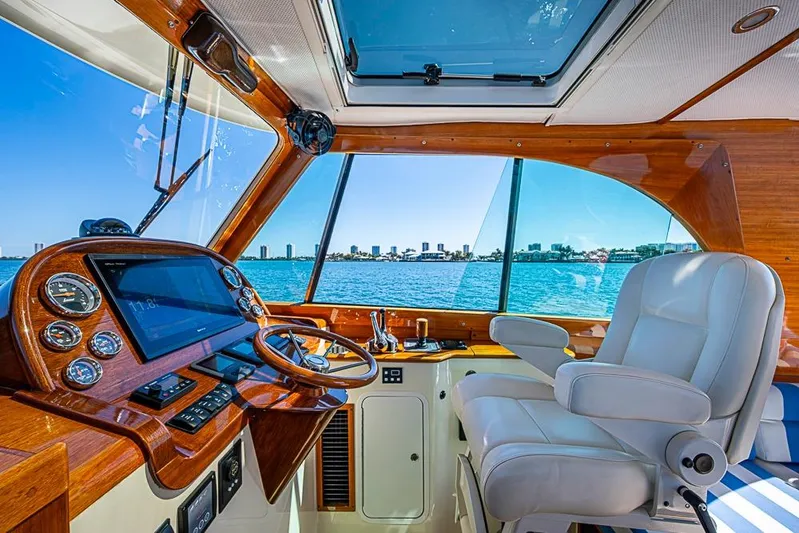 Odelay Yacht Photos Pics Interior of 2016 Hinckley Picnic Boat MKIII with luxurious helm and waterfront view.