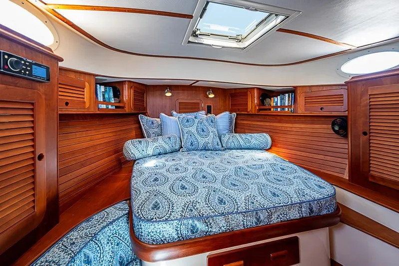 Odelay Yacht Photos Pics Luxurious cabin interior of 2016 Hinckley Picnic Boat MKIII with elegant wood finish.