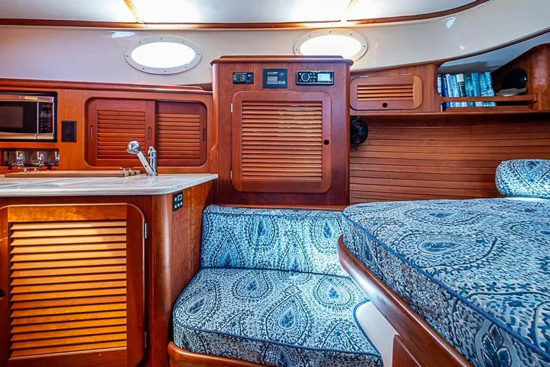 Odelay Yacht Photos Pics Interior of 2016 Hinckley Picnic Boat MKIII with wood paneling and patterned seating.