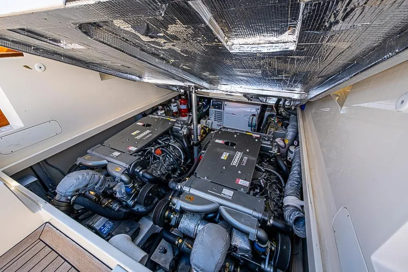 Odelay Yacht Photos Pics Engine compartment of 2016 Hinckley Picnic Boat MKIII, showcasing dual engines and mechanical components.