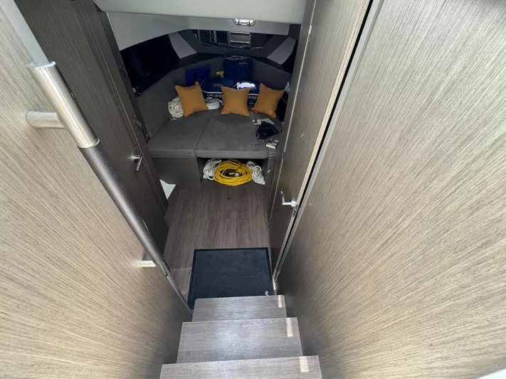  Yacht Photos Pics 2024 Beneteau Gran Turismo 32 interior cabin with stairs and seating area.