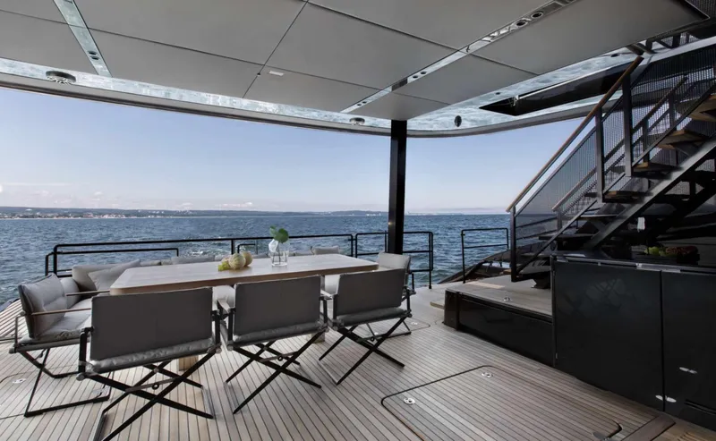 Grayone Yacht Photos Pics Luxurious Sunreef 80 sailing yacht deck with dining area, ocean view, and modern design, 2020 model.