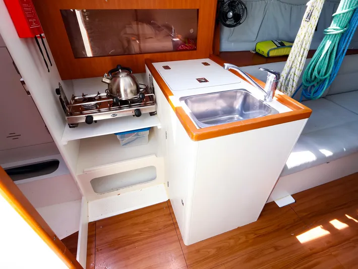  Yacht Photos Pics Compact galley in 2020 J Boats J/99 sailboat with stove, sink, and storage.