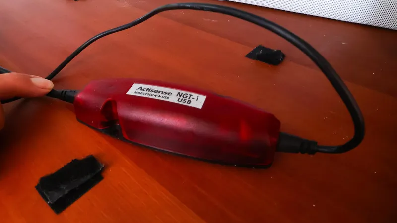  Yacht Photos Pics Actisense NGT-1 USB device on wooden surface, connected to cables.