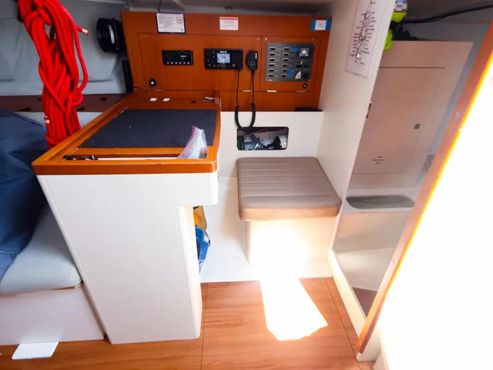  Yacht Photos Pics Interior of 2020 J Boats J/99 sailboat with navigation station and control panel.