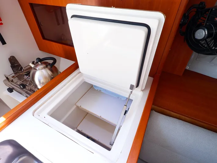  Yacht Photos Pics 2020 J Boats J/99 interior with open storage compartment and stove.