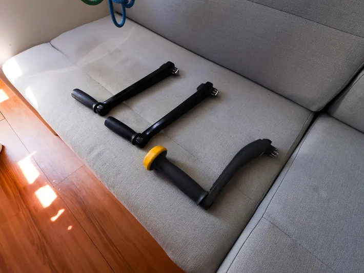  Yacht Photos Pics Sailboat winch handles on a gray sofa, J Boats J/99, 2020 model.