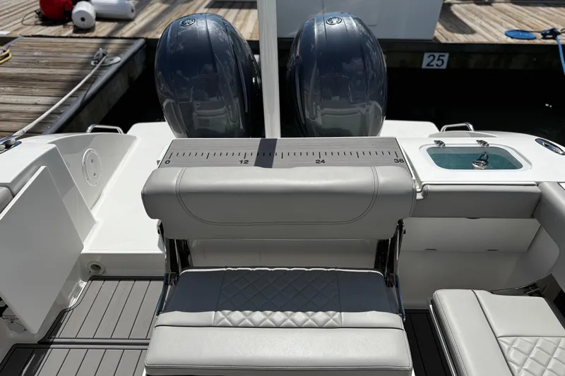 Luna Sea Yacht Photos Pics 2023 Pursuit DC 266 Dual Console boat with dual engines and sleek seating at the dock.