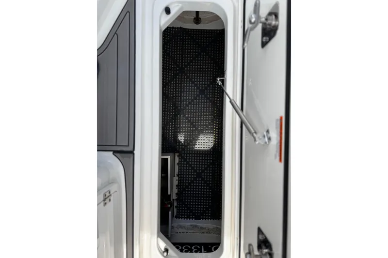 Luna Sea Yacht Photos Pics 2023 Pursuit DC 266 Dual Console interior cabin view with open door.