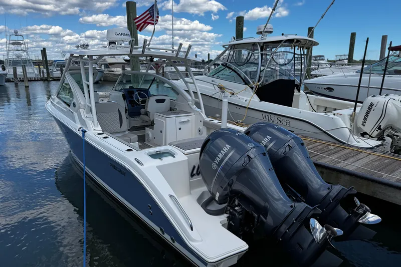 Luna Sea Yacht Photos Pics 2023 Pursuit DC 266 Dual Console boat docked with twin Yamaha engines.
